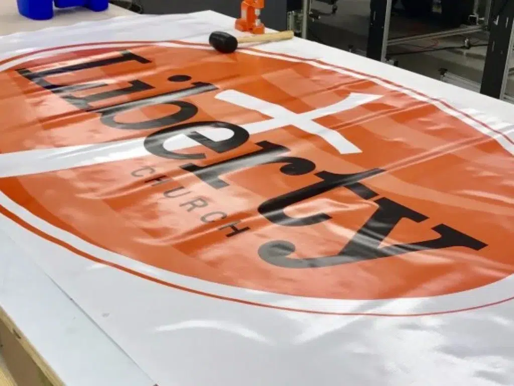 Liberty Church banner being printed.